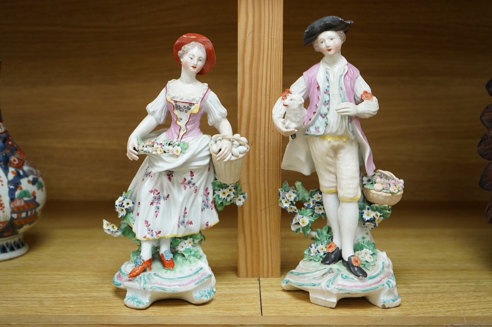 A Derby figure of a gentleman, c.1760, and a Continental porcelain figure, pseudo Bow mark, tallest 26cm high (2)